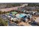 Aerial view of community pool, tennis courts, and surrounding neighborhood at 104 Warm Wood Ln, Apex, NC 27539