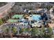 Aerial view of the community amenities showcasing the pool, playground, and tennis courts at 104 Warm Wood Ln, Apex, NC 27539