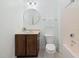 Bathroom shows a toilet, sink, vanity and tub/shower with neutral paint, hardware and decor at 104 Warm Wood Ln, Apex, NC 27539