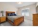 Bedroom featuring a bed, neutral paint, carpet and a window bringing in light at 104 Warm Wood Ln, Apex, NC 27539