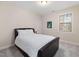 Bedroom featuring a bed, neutral paint, carpet and a window bringing in light at 104 Warm Wood Ln, Apex, NC 27539