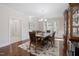 Elegant dining room with hardwood floors, stylish chandelier, and ample seating at 104 Warm Wood Ln, Apex, NC 27539