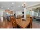 Open concept kitchen and dining area with access to outdoor patio at 104 Warm Wood Ln, Apex, NC 27539