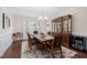 Traditional dining room with wood table, chandelier, and elegant wood china cabinet at 104 Warm Wood Ln, Apex, NC 27539
