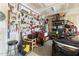 Organized garage with tools on pegboard and storage shelves for easy access to equipment at 104 Warm Wood Ln, Apex, NC 27539