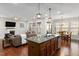 Open floor plan showcasing kitchen, living room and breakfast nook with plenty of natural light at 104 Warm Wood Ln, Apex, NC 27539