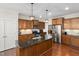 Modern kitchen featuring stainless steel appliances, granite countertops and center island at 104 Warm Wood Ln, Apex, NC 27539