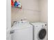 Well-equipped laundry room with appliances and storage shelves for convenience at 104 Warm Wood Ln, Apex, NC 27539