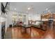 Spacious living room with fireplace open to kitchen and dining areas at 104 Warm Wood Ln, Apex, NC 27539