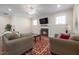 Cozy living room featuring a fireplace and hardwood floors at 104 Warm Wood Ln, Apex, NC 27539