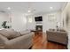 Inviting living room with fireplace, ceiling fan, and comfortable seating at 104 Warm Wood Ln, Apex, NC 27539