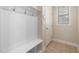 Mud room shows shelving, coat hooks, and a door to the garage, all with neutral paint and tile flooring at 104 Warm Wood Ln, Apex, NC 27539