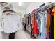 Spacious walk-in closet with ample storage, hanging racks, and shelving at 104 Warm Wood Ln, Apex, NC 27539