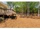 Backyard features a wooden deck with a view of a fenced yard with mature trees at 107 Myers Farm Ct, Cary, NC 27519