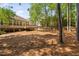 The home's spacious backyard features a wooden deck, creating a serene outdoor retreat at 107 Myers Farm Ct, Cary, NC 27519