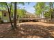 Spacious backyard featuring a wooden deck and stairs, perfect for outdoor gatherings at 107 Myers Farm Ct, Cary, NC 27519