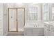 Bathroom with a soaking tub, shower, and double vanity at 107 Myers Farm Ct, Cary, NC 27519