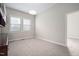Bedroom featuring built-in cabinets, neutral carpet and ample natural light from a large window at 107 Myers Farm Ct, Cary, NC 27519