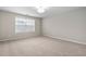 Bedroom featuring neutral walls, carpet, a window and a globe light at 107 Myers Farm Ct, Cary, NC 27519