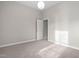 Bedroom featuring neutral walls, carpet, and an open doorway at 107 Myers Farm Ct, Cary, NC 27519