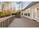 Wooden deck with railings spanning the back of the house, offering outdoor space at 107 Myers Farm Ct, Cary, NC 27519