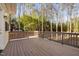 Large wooden deck features wood railing and backyard views at 107 Myers Farm Ct, Cary, NC 27519