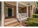 Inviting front porch with white railings and brick steps, leading to the home's entrance at 107 Myers Farm Ct, Cary, NC 27519