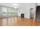 Bright living room with large windows, a fireplace, and hardwood floors at 107 Myers Farm Ct, Cary, NC 27519