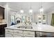 Large kitchen island with double sink, granite countertop and breakfast bar seating at 1113 Magnolia Bend Loop, Cary, NC 27519