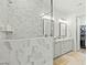 Spa-like bathroom with marble shower and double vanity at 1135 Laurelwood Dr, Durham, NC 27705