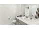 Small bathroom with gray vanity and white toilet at 1135 Laurelwood Dr, Durham, NC 27705