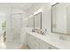 Spa-like bathroom featuring a walk-in shower and double vanity at 1135 Laurelwood Dr, Durham, NC 27705
