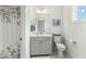 Modern bathroom with gray vanity, white toilet and shower at 1135 Laurelwood Dr, Durham, NC 27705