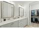 Elegant bathroom with double vanity, large mirror, and walk-in shower at 1135 Laurelwood Dr, Durham, NC 27705