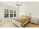 Spacious bedroom with king-size bed and ceiling fan at 1135 Laurelwood Dr, Durham, NC 27705