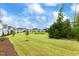 Green lawn and tree-lined community view at 1135 Laurelwood Dr, Durham, NC 27705