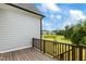 Wooden deck overlooking backyard and community at 1135 Laurelwood Dr, Durham, NC 27705