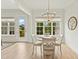 Charming dining area with round table and access to deck at 1135 Laurelwood Dr, Durham, NC 27705