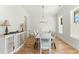 Elegant dining room featuring a rustic wooden table at 1135 Laurelwood Dr, Durham, NC 27705