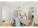 Spacious dining room with a chandelier and hardwood floors at 1135 Laurelwood Dr, Durham, NC 27705