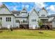 Gray house back with two wooden decks and stairs at 1135 Laurelwood Dr, Durham, NC 27705