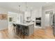 Contemporary kitchen with white cabinets, center island, and stainless steel appliances at 1135 Laurelwood Dr, Durham, NC 27705