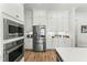 Bright kitchen boasts stainless steel appliances and ample cabinetry at 1135 Laurelwood Dr, Durham, NC 27705