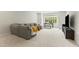 Bright living room with sectional sofa and large window at 1135 Laurelwood Dr, Durham, NC 27705