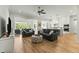 Open living space with hardwood floors and gray sofas at 1135 Laurelwood Dr, Durham, NC 27705