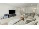 Spacious living room with sectional sofa and large TV at 1135 Laurelwood Dr, Durham, NC 27705