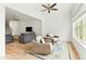 Cozy sitting area with wicker chairs, rug, and a view into the living room at 1135 Laurelwood Dr, Durham, NC 27705
