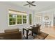 Relaxing sunroom with wicker chairs, large windows, and access to deck at 1135 Laurelwood Dr, Durham, NC 27705
