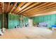 Unfinished basement with exposed beams and framing at 1135 Laurelwood Dr, Durham, NC 27705