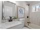 Clean bathroom with a bathtub, shower, and modern vanity at 1404 Valley Rd, Garner, NC 27529